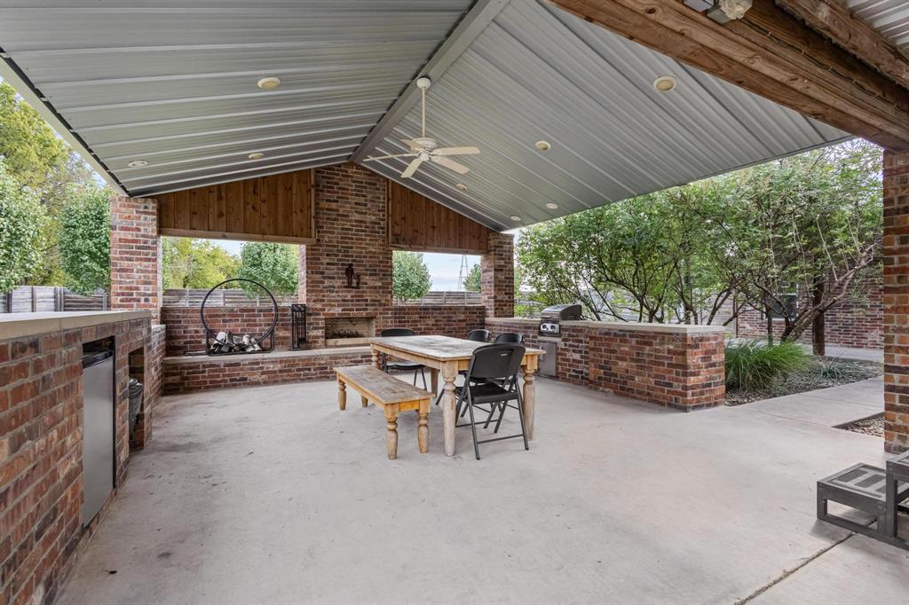 595 Pleasant Home Road Sherman, TX 75092 - Photo 7 of 40 a backyard of a house with table and chairs