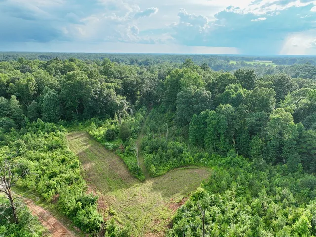 a balcony with table and chairs
