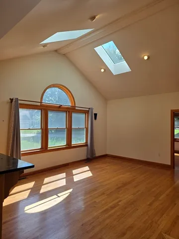 a view of an empty room with glass door