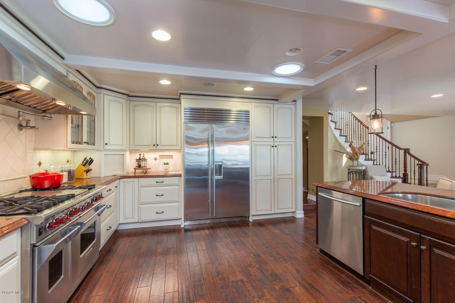 2301 Peninsula Road Oxnard, CA 93035 - Photo 11 of 37 a kitchen with stainless steel appliances granite countertop a stove and a refrigerator