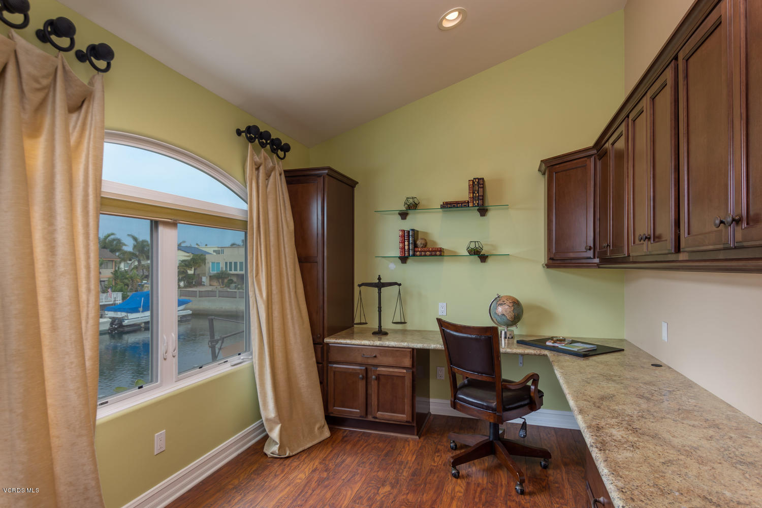 2301 Peninsula Road Oxnard, CA 93035 - Photo 15 of 37 a view of a workspace with furniture and a window