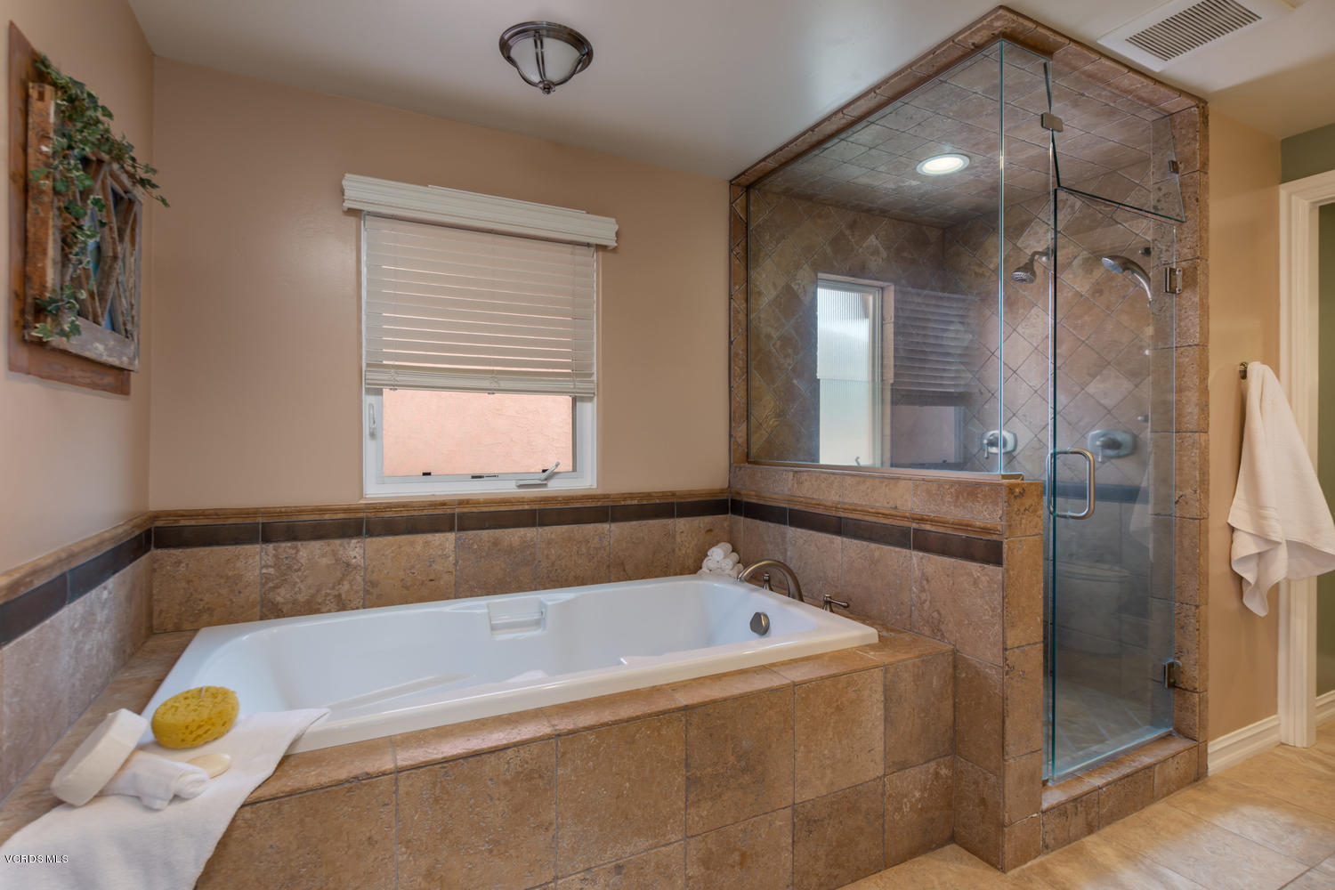 2301 Peninsula Road Oxnard, CA 93035 - Photo 16 of 37 a bathroom with a tub and shower