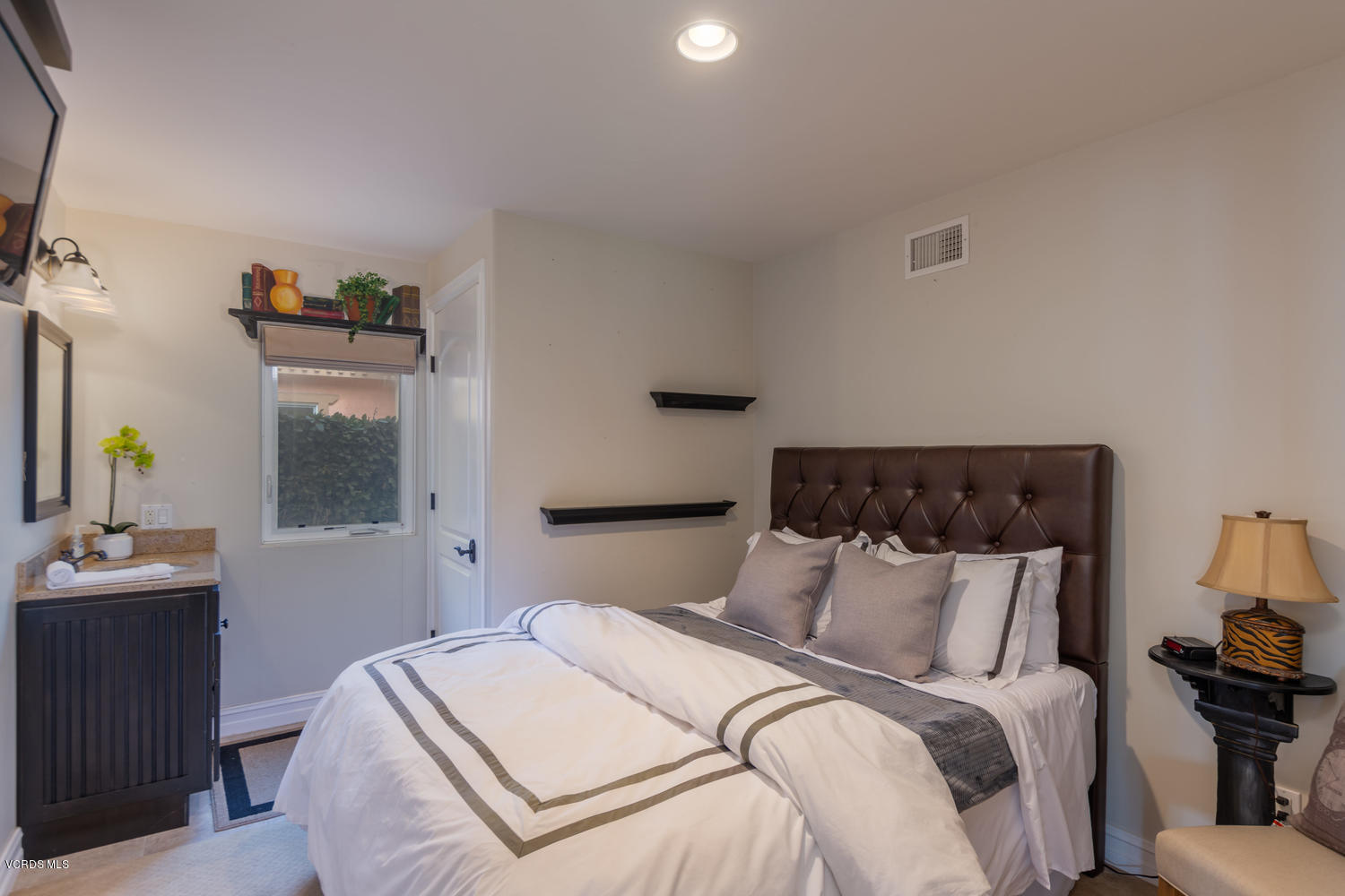 2301 Peninsula Road Oxnard, CA 93035 - Photo 18 of 37 a bedroom with bed and window