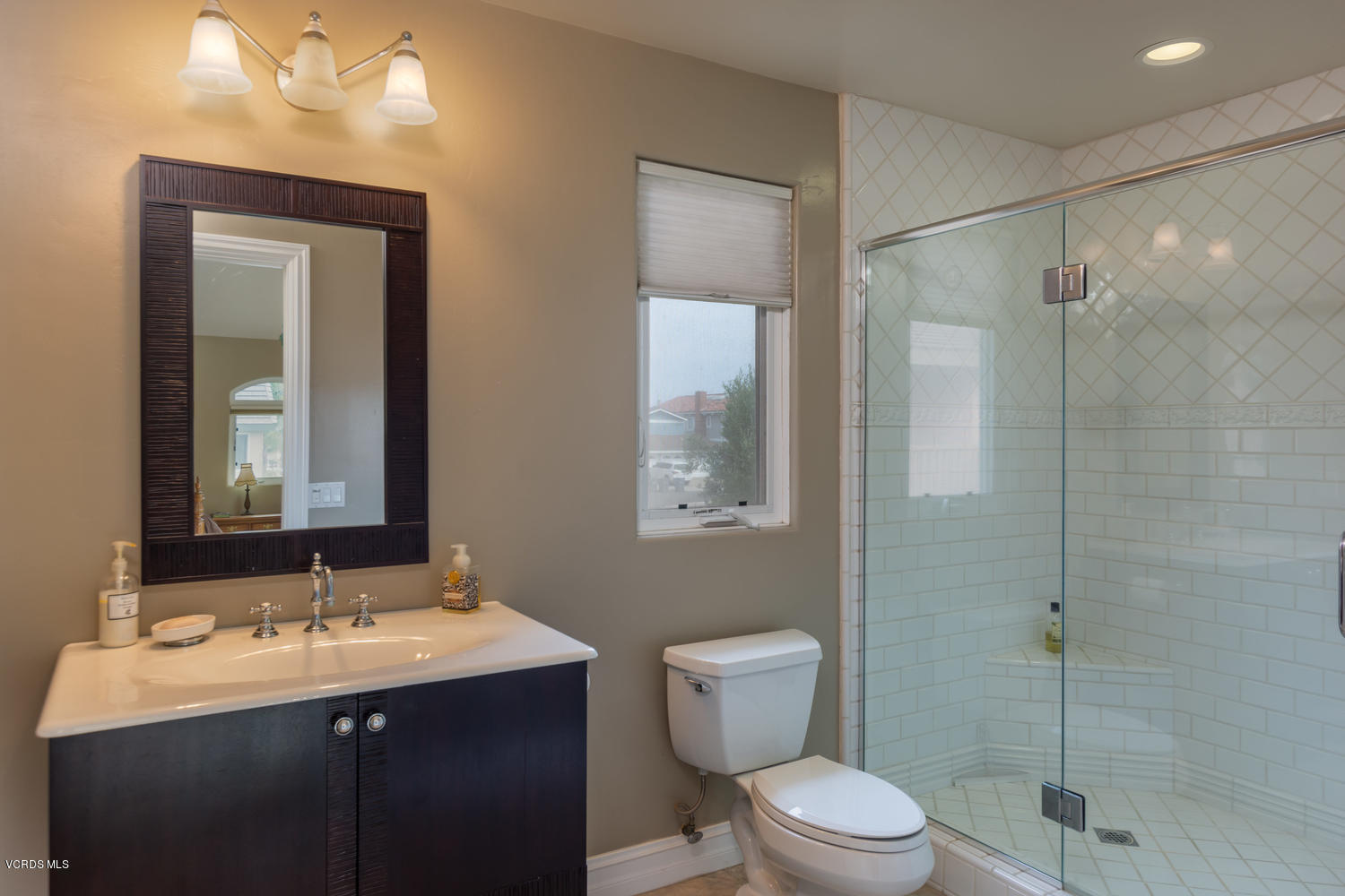 2301 Peninsula Road Oxnard, CA 93035 - Photo 21 of 37 a bathroom with a sink toilet and shower
