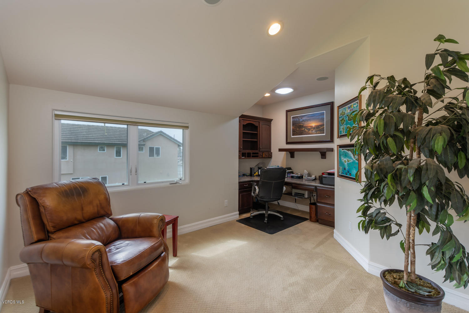 2301 Peninsula Road Oxnard, CA 93035 - Photo 24 of 37 a living room with furniture plant and a flat screen tv