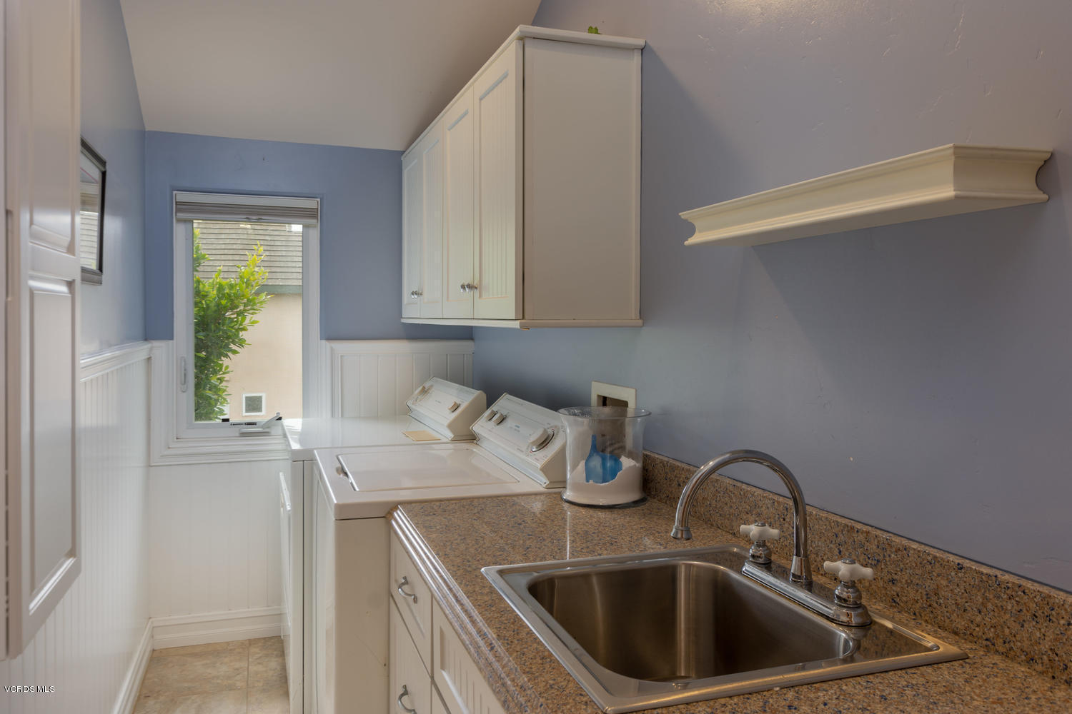 2301 Peninsula Road Oxnard, CA 93035 - Photo 25 of 37 a kitchen with a sink cabinets and a window