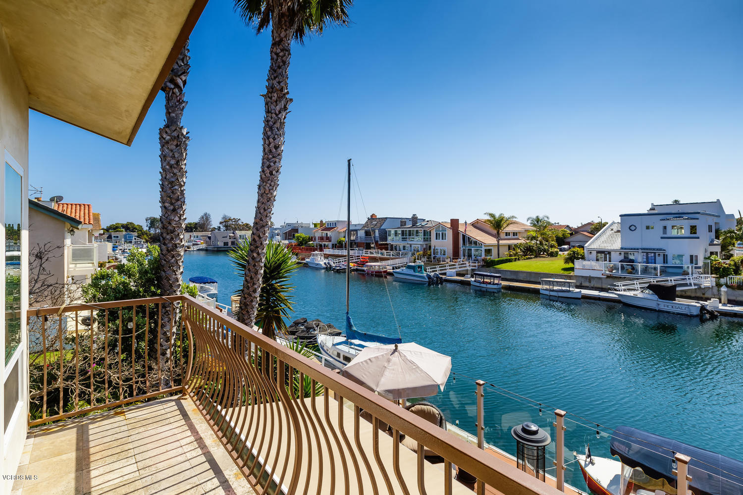 2301 Peninsula Road Oxnard, CA 93035 - Photo 27 of 37 a view of a lake with boats and palm trees
