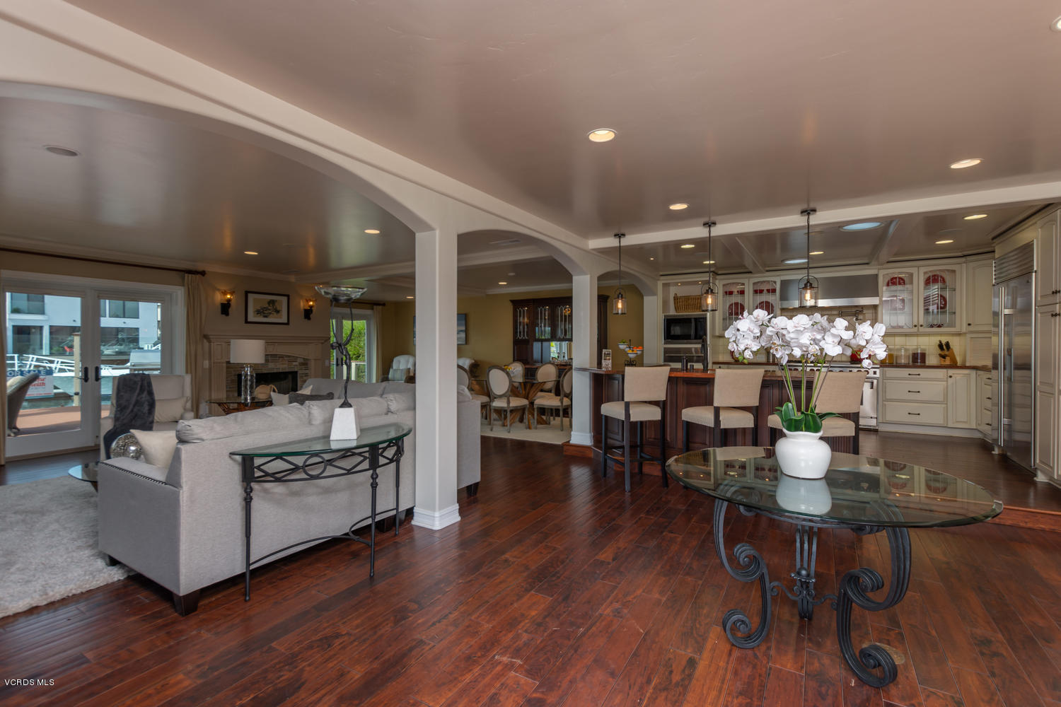 2301 Peninsula Road Oxnard, CA 93035 - Photo 4 of 37 a view of a dining room with furniture wooden floor and chandelier