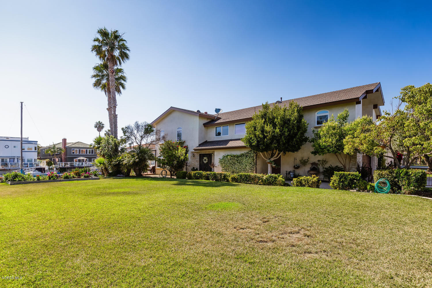 2301 Peninsula Road Oxnard, CA 93035 - Photo 32 of 37 a front view of a house with a yard