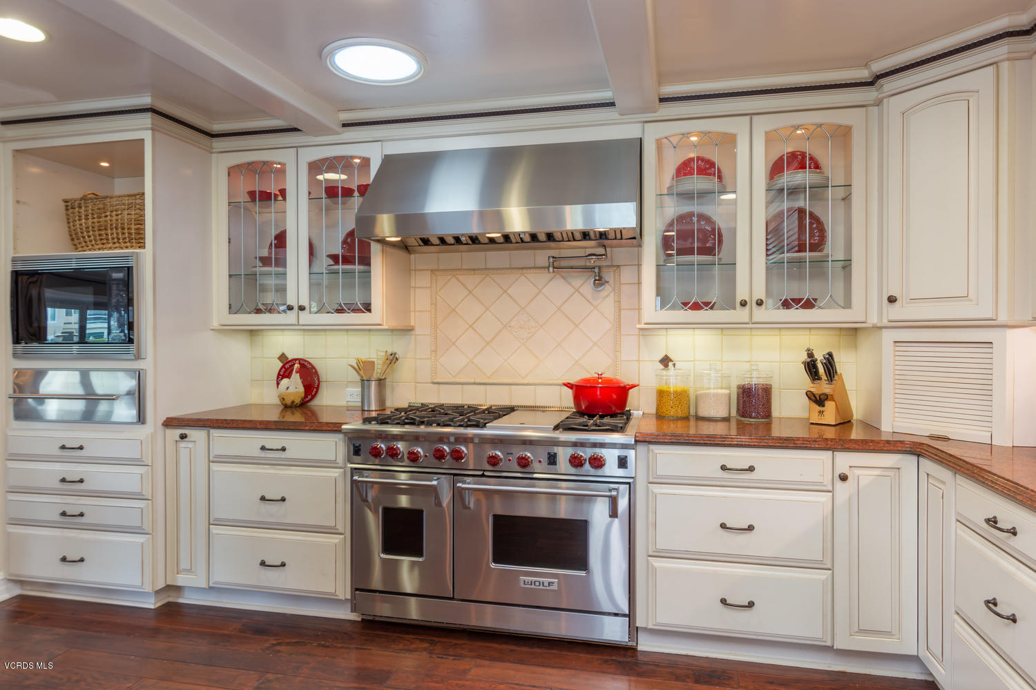 2301 Peninsula Road Oxnard, CA 93035 - Photo 10 of 37 a kitchen with stainless steel appliances a stove and cabinets