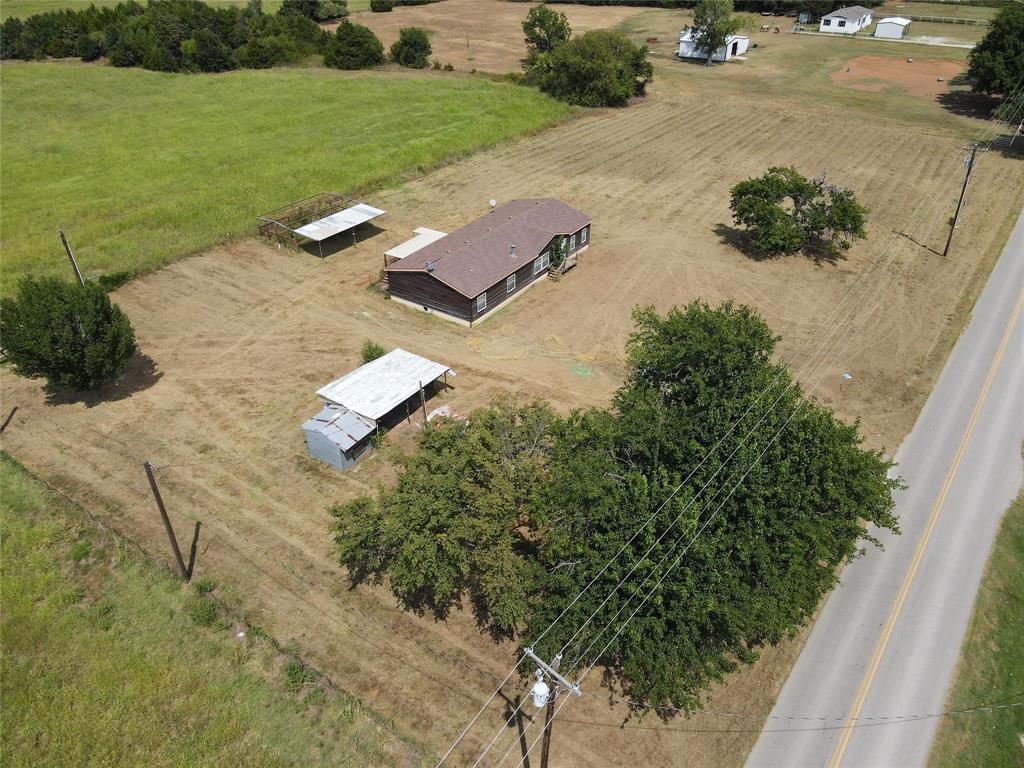 an aerial view of a house with outdoor space