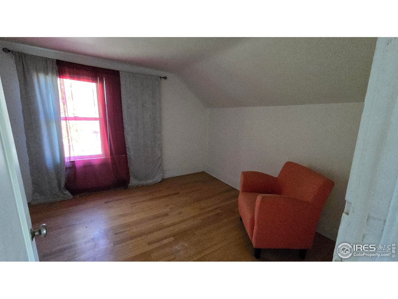 323 North 4th Street Sterling, CO 80751 - Photo 17 of 23 a room with furniture and a window