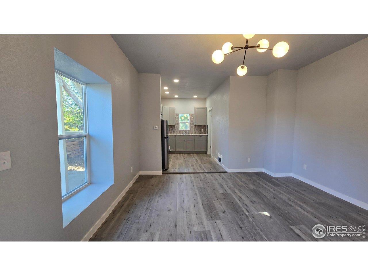 323 North 4th Street Sterling, CO 80751 - Photo 6 of 23 a bathroom with a sink vanity and a mirror