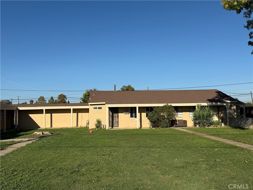 981 Barney Street Merced, CA 95340 - Photo 2 of 8 a front view of a house with a yard and lake
