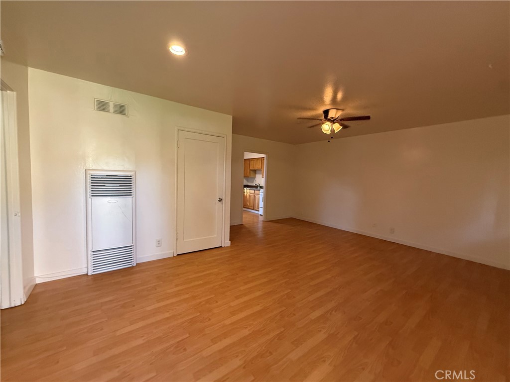 981 Barney Street Merced, CA 95340 - Photo 4 of 8 a view of an empty room with a ceiling fan