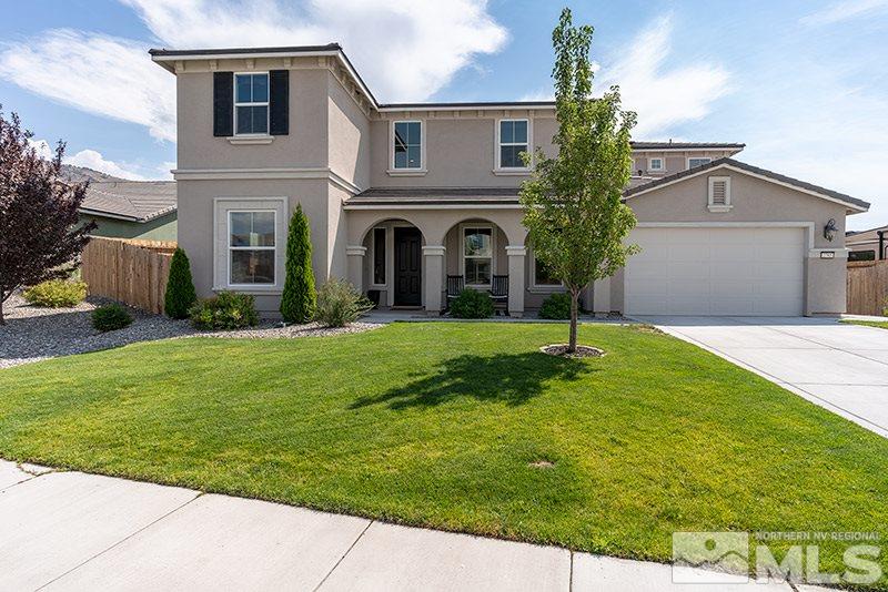 2785 Tobiano Drive Reno, NV 89521 - Photo 1 of 27 a front view of a house with a yard and garage