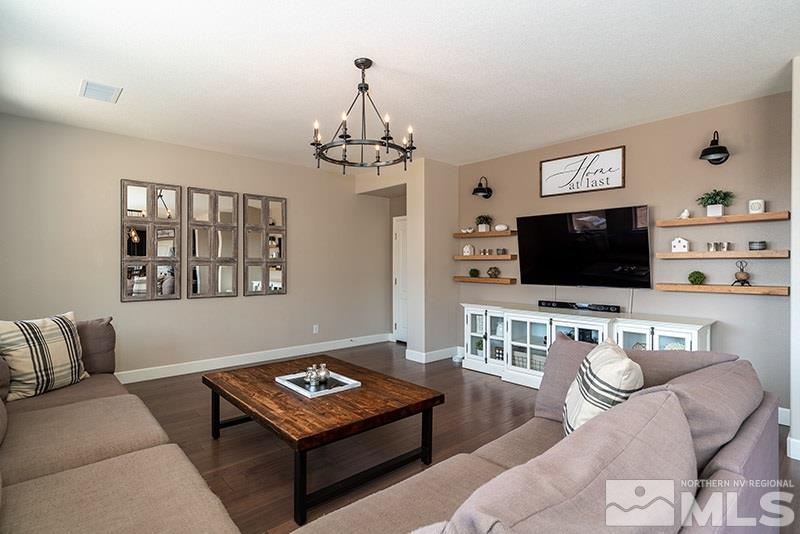 2785 Tobiano Drive Reno, NV 89521 - Photo 5 of 27 a living room with furniture and a flat screen tv