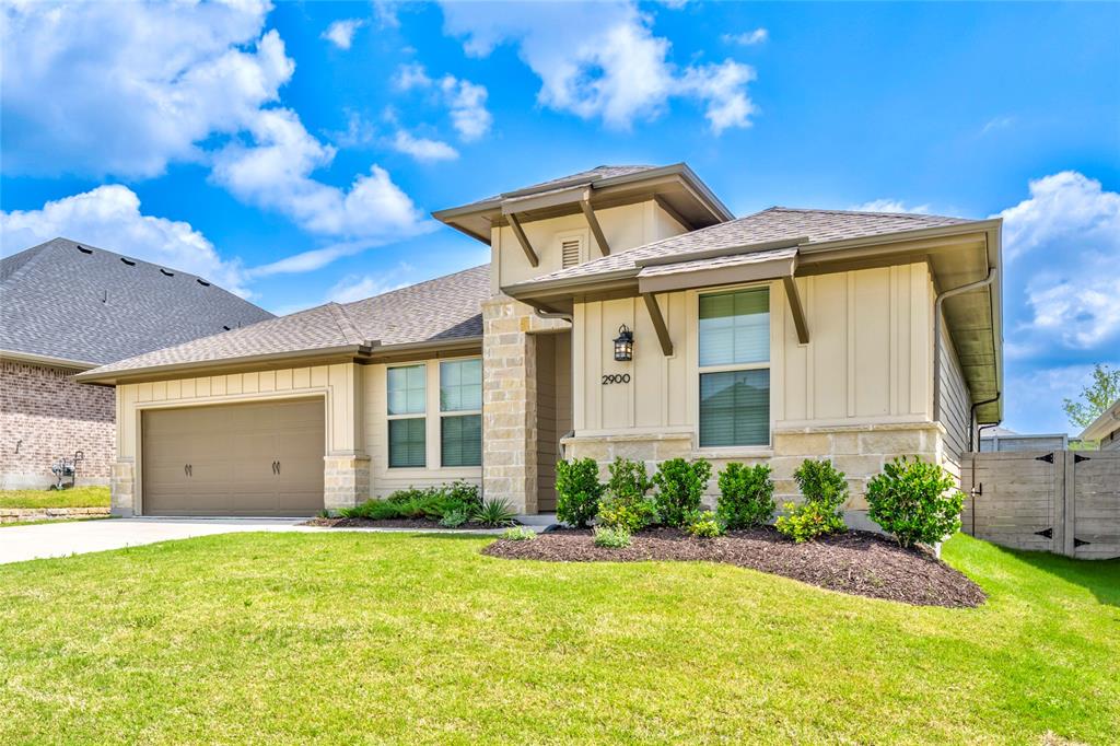 2900 Barbary Road McKinney, TX 75071 - Photo 2 of 36 Single-story residence featuring a stone and siding facade, an attached two-car garage, and a landscaped front yard with a concrete driveway