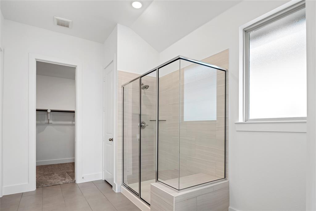 2900 Barbary Road McKinney, TX 75071 - Photo 25 of 36 Glass-enclosed shower with a tiled surround