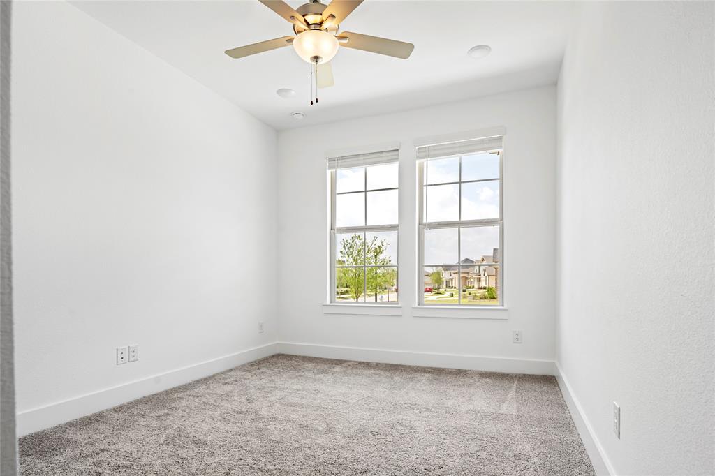 2900 Barbary Road McKinney, TX 75071 - Photo 28 of 36 Bright room featuring dual windows with blinds, recessed lighting, a ceiling fan with light fixture, and plush carpeting