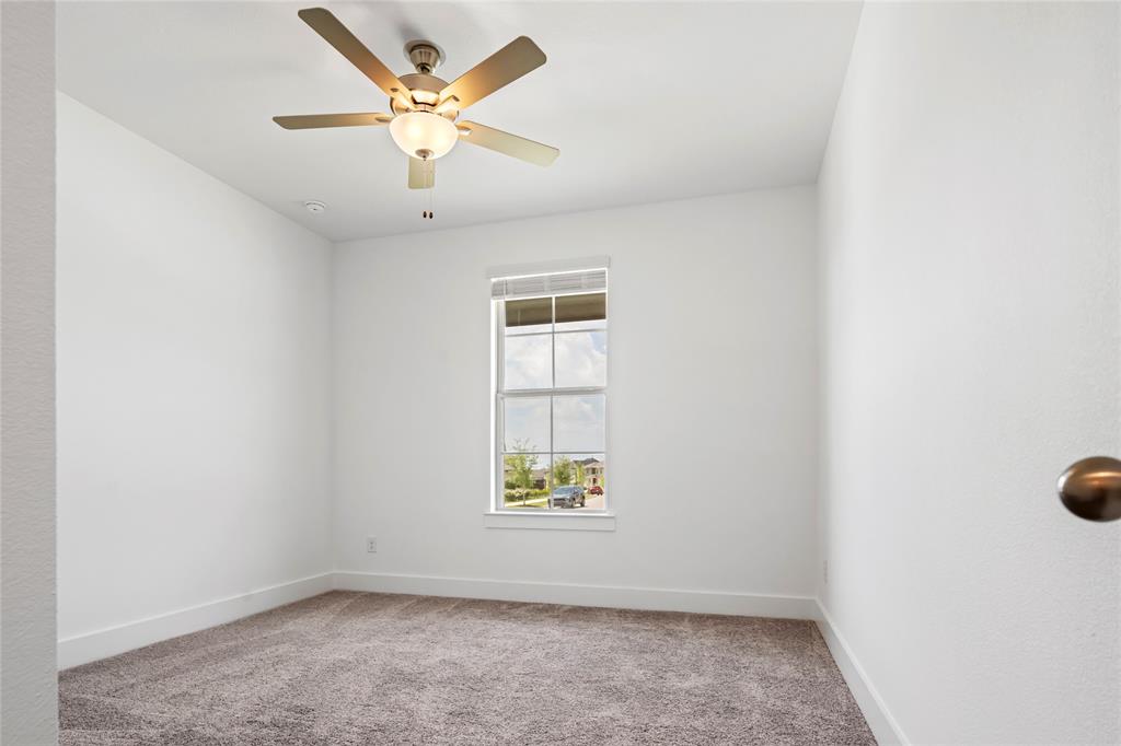 2900 Barbary Road McKinney, TX 75071 - Photo 33 of 36 Carpeted interior room featuring a ceiling fan with integrated lighting, a single window, white baseboards, and white walls