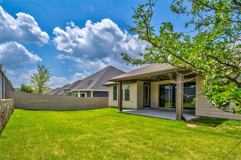 2900 Barbary Road McKinney, TX 75071 - Photo 34 of 36 Expansive backyard featuring a manicured lawn, a full concrete patio, and a covered patio area with a ceiling fan