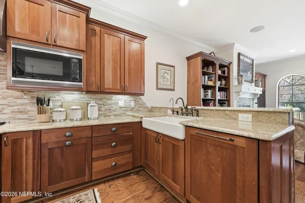 a spacious bathroom with a tub sink and mirror