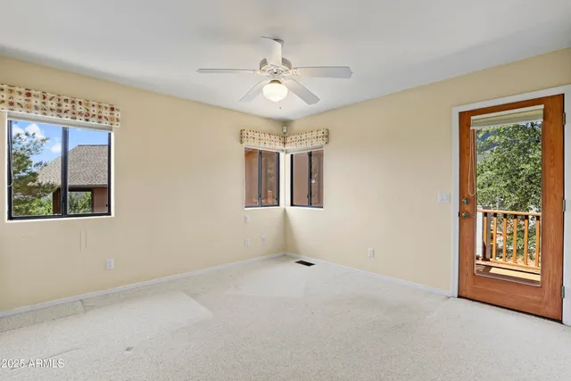 a bathroom with a granite countertop sink a toilet and a mirror