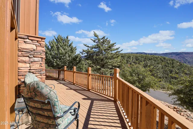 a view of a balcony with wooden floor