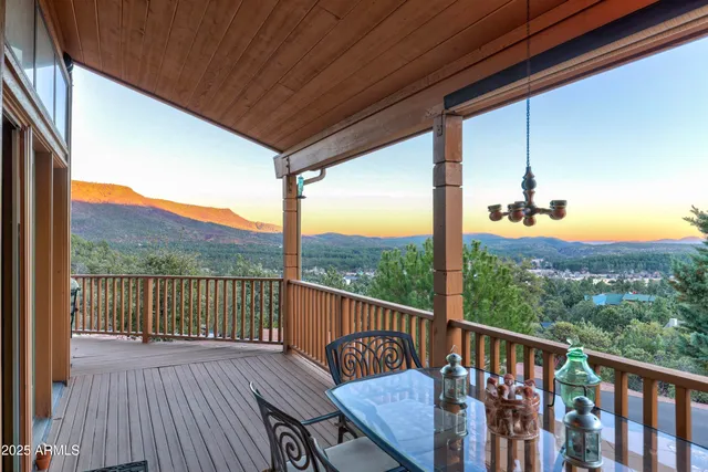a view of balcony with wooden floor