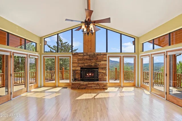 a view of an entryway with a fireplace and window