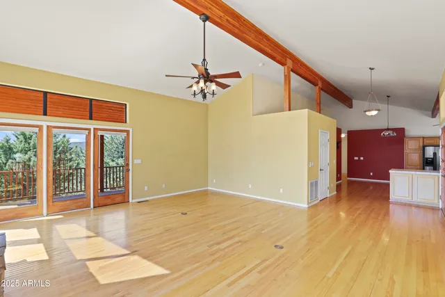 a kitchen with stainless steel appliances granite countertop a sink and a refrigerator