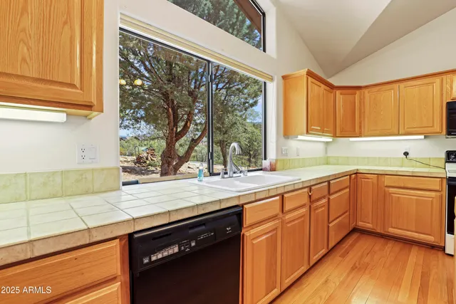 a kitchen with stainless steel appliances a refrigerator and a stove