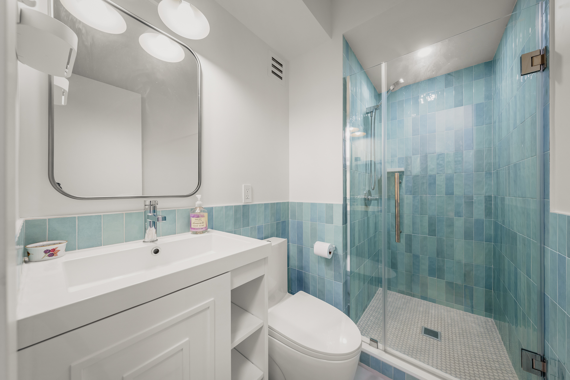 176 East 77th Street, Unit 5E Manhattan, NY 10075 - Photo 10 of 11 a bathroom with a sink a toilet and shower