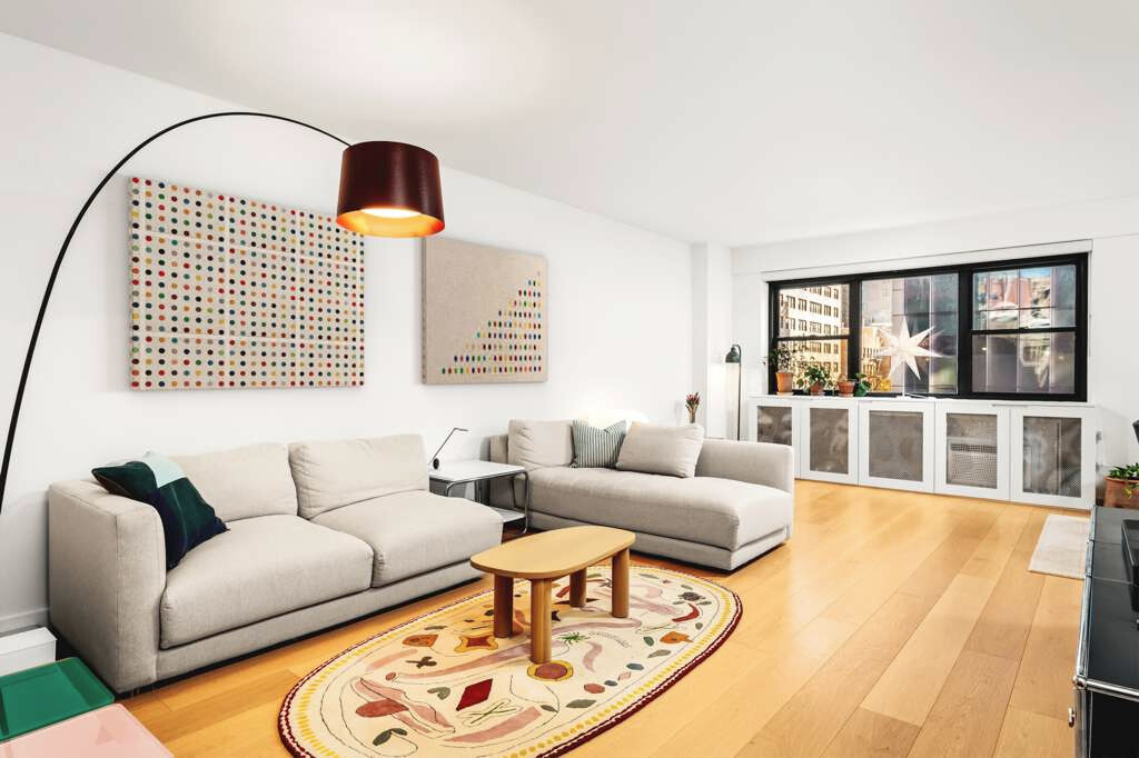 176 East 77th Street, Unit 5E Manhattan, NY 10075 - Photo 2 of 11 a living room with furniture and a window