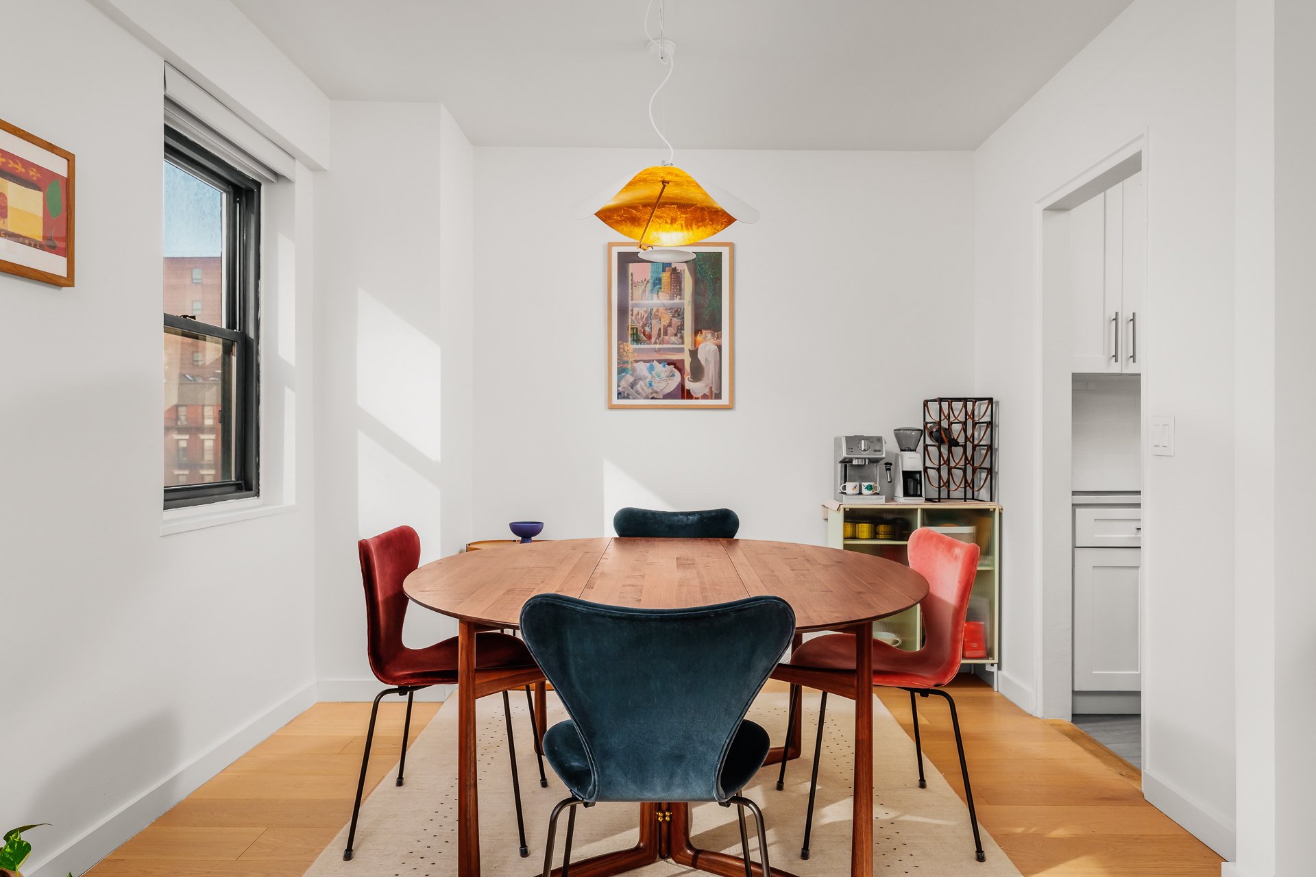 176 East 77th Street, Unit 5E Manhattan, NY 10075 - Photo 5 of 11 a dining room with furniture and wooden floor