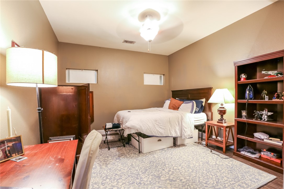 910 West 25th Street, Unit 204 Austin, TX 78705 - Photo 17 of 27 a bed room with a bed and a book shelf