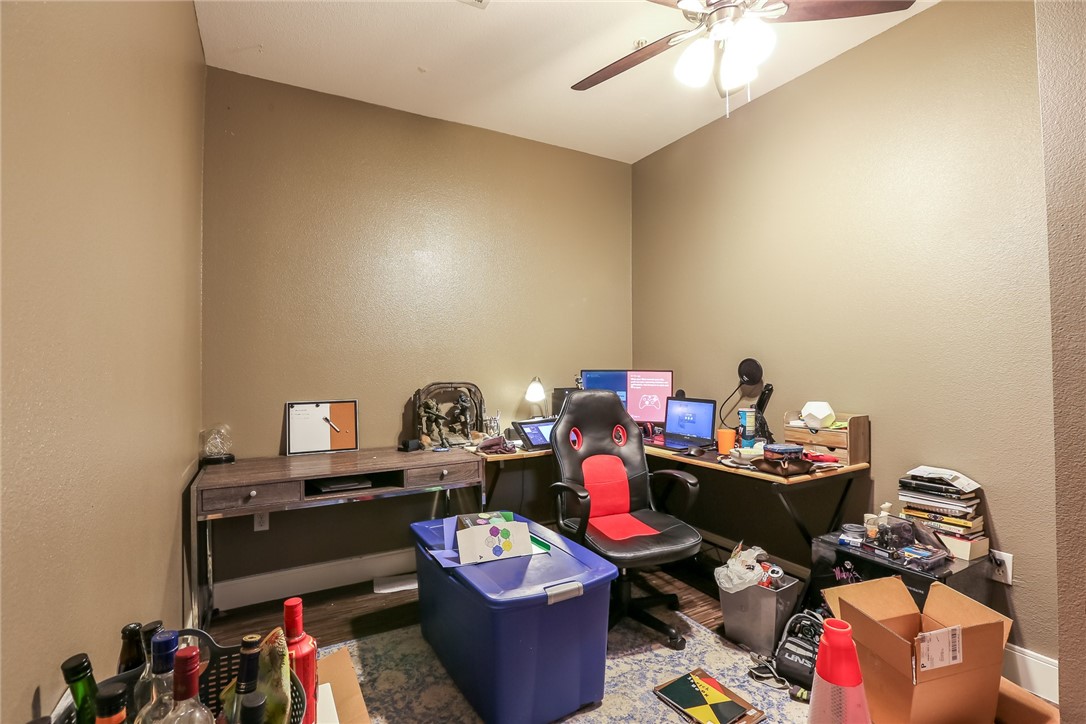 910 West 25th Street, Unit 204 Austin, TX 78705 - Photo 19 of 27 a living room with furniture and a wooden floor