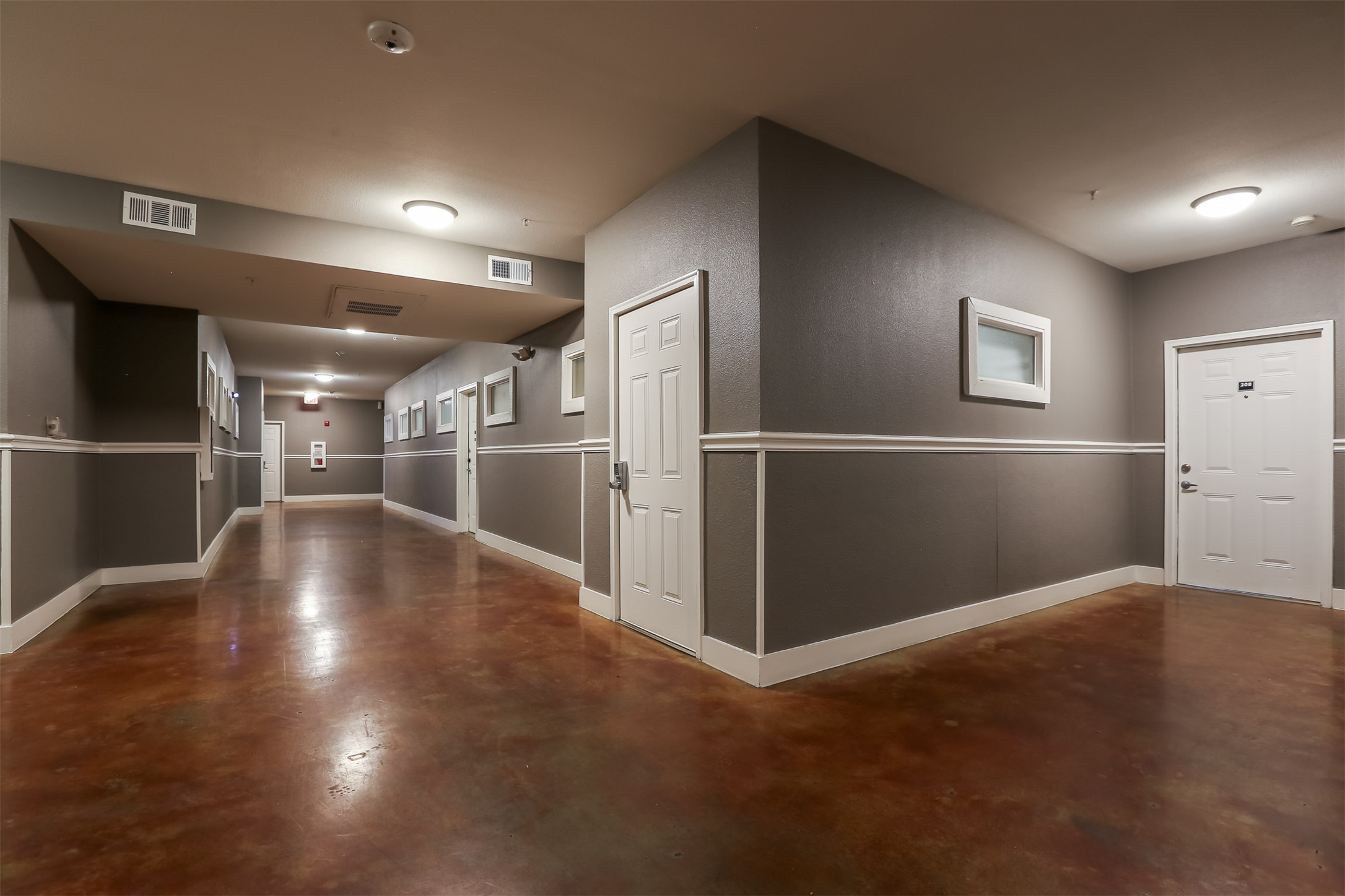 910 West 25th Street, Unit 204 Austin, TX 78705 - Photo 21 of 27 a view of empty room with wooden floor
