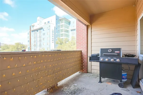 a view of a balcony with an outdoor space