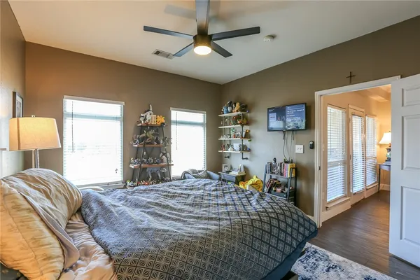 a bed room with a bed and a chandelier