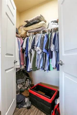 a room with lots of different colored cloths