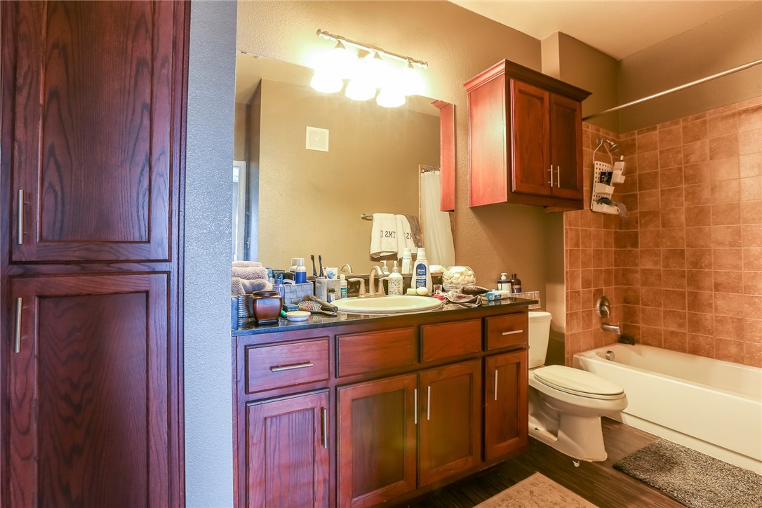 910 West 25th Street, Unit 204 Austin, TX 78705 - Photo 8 of 27 a bathroom with a sink a toilet and shower