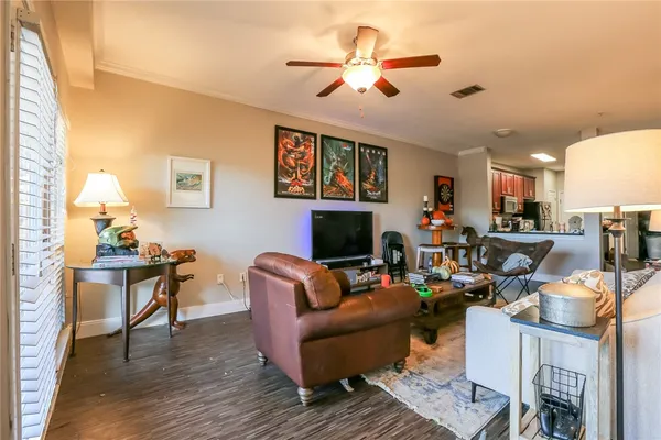 a living room with furniture fireplace and a lamp