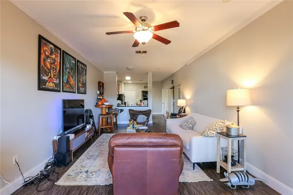 a kitchen with stainless steel appliances granite countertop a refrigerator stove microwave and sink
