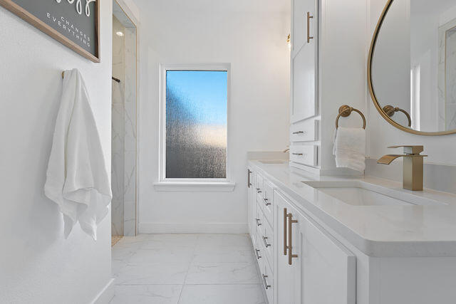 823 13th Street Wolfforth, TX 79382 - Photo 16 of 32 a bathroom with a sink and a mirror