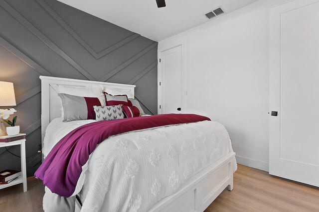 823 13th Street Wolfforth, TX 79382 - Photo 19 of 32 a bed sitting in a bedroom next to a window