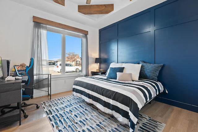 823 13th Street Wolfforth, TX 79382 - Photo 21 of 32 a bedroom with a bed and a large window