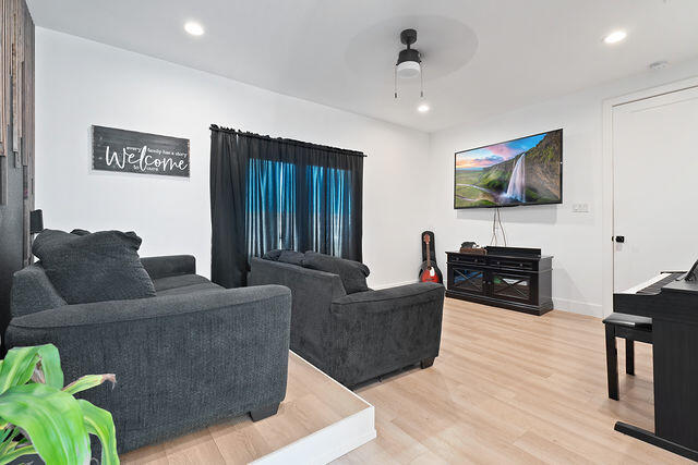 823 13th Street Wolfforth, TX 79382 - Photo 27 of 32 a living room with furniture and a flat screen tv