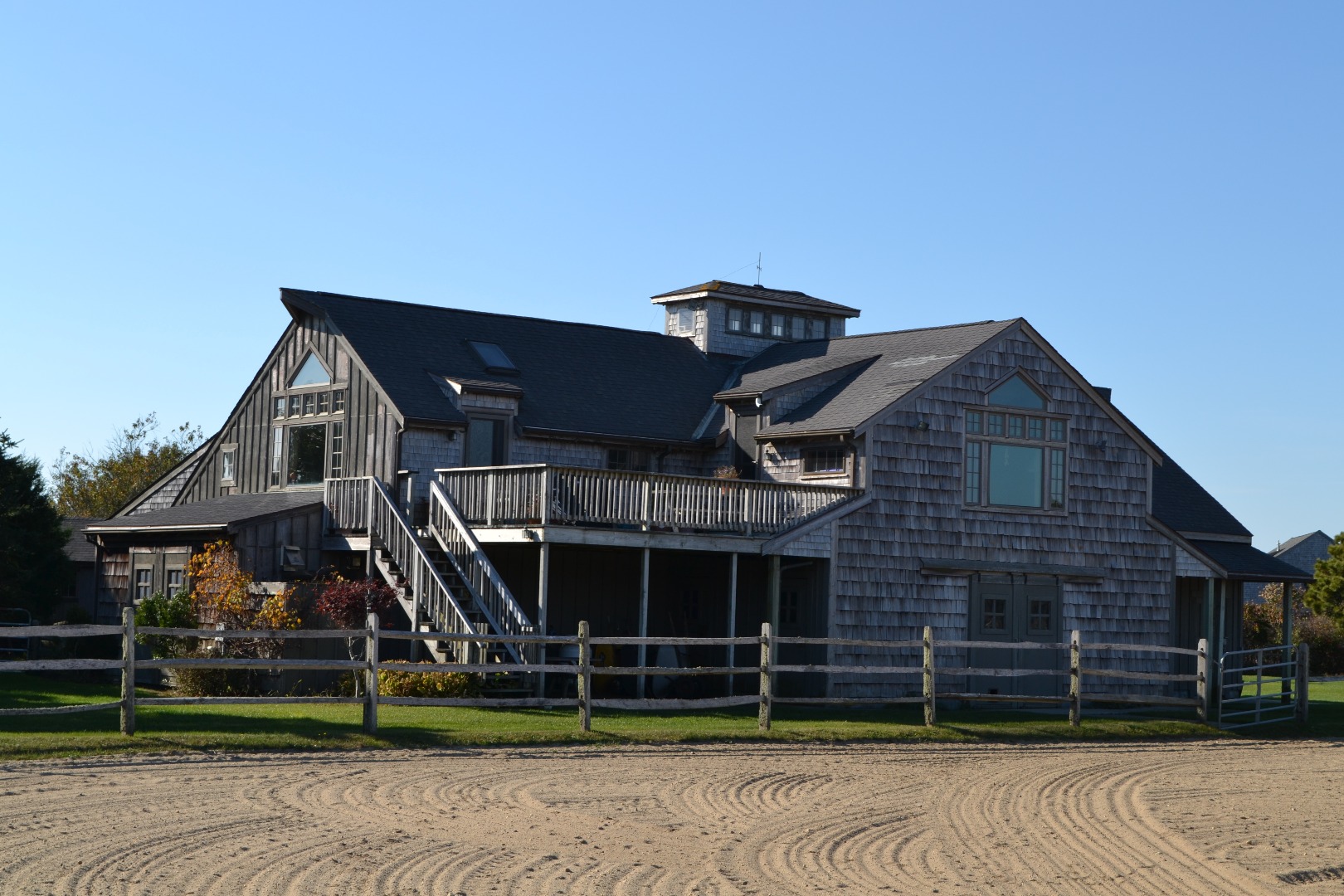 64 South Shore Road Nantucket, MA 02554 - Photo 1 of 15 a front view of a house with a garden